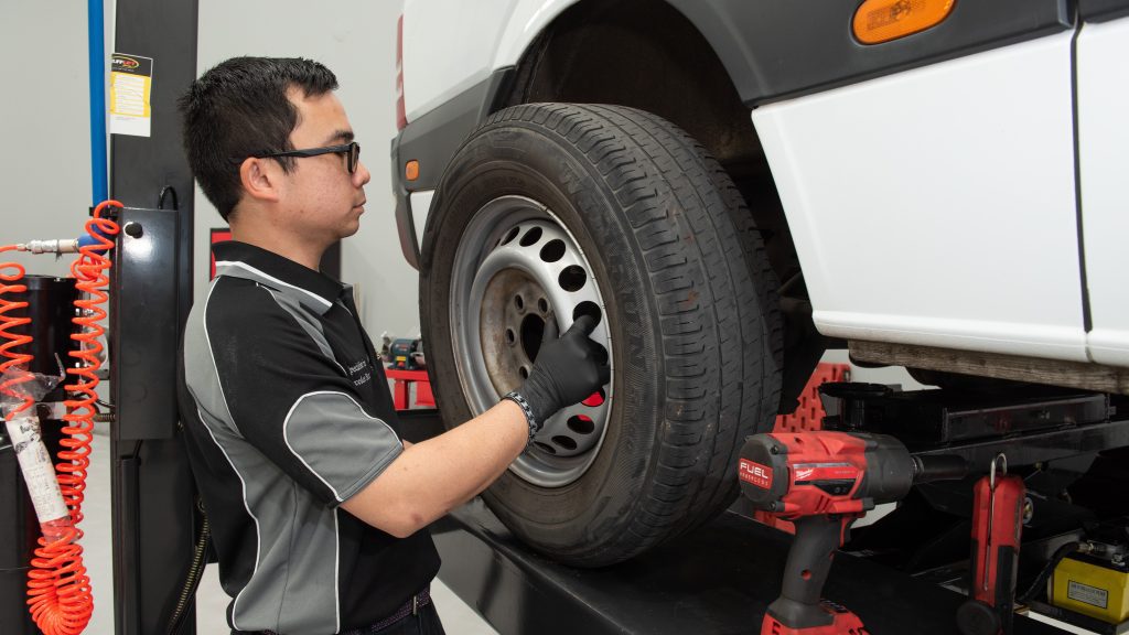 mercedes technician removing tyres from a sprinter van