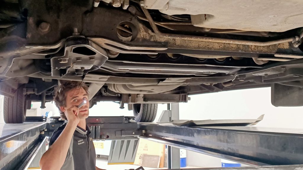 mercedes expert technician specialist inspecting vehicle