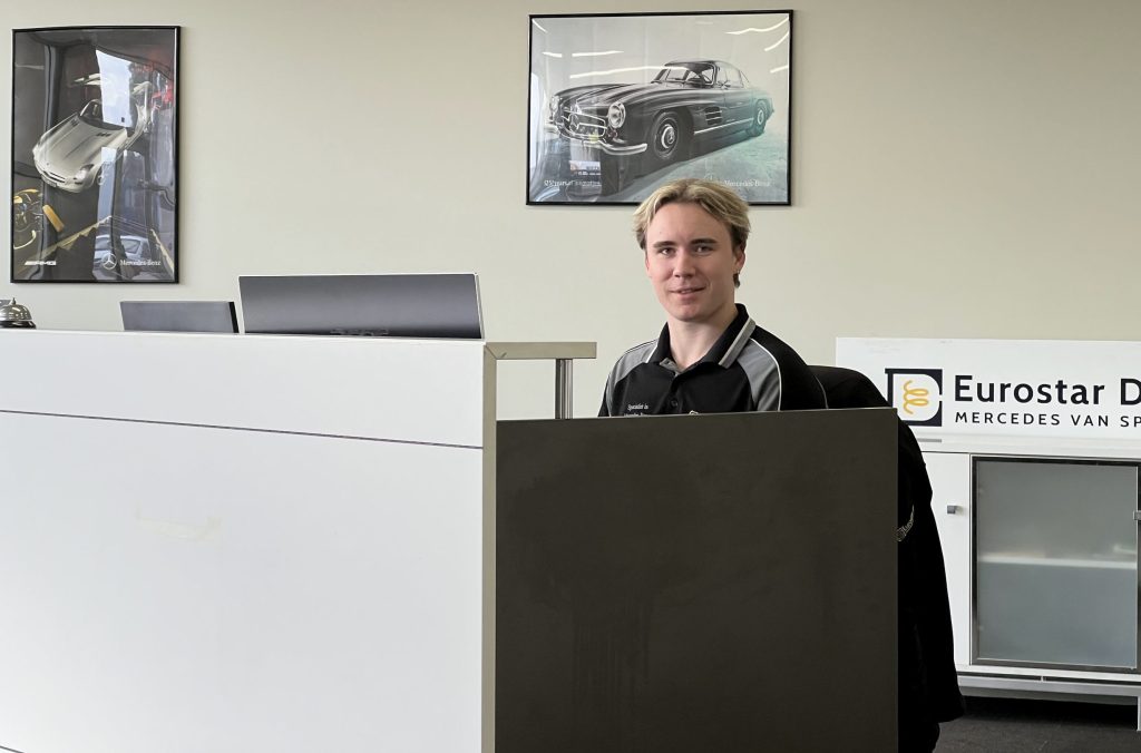 mercedes diesel expert james at reception desk greeting customers with a smile