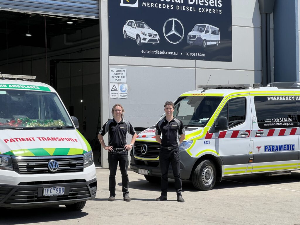 technicians standing in front of ambulance vehicles at eurostar diesels