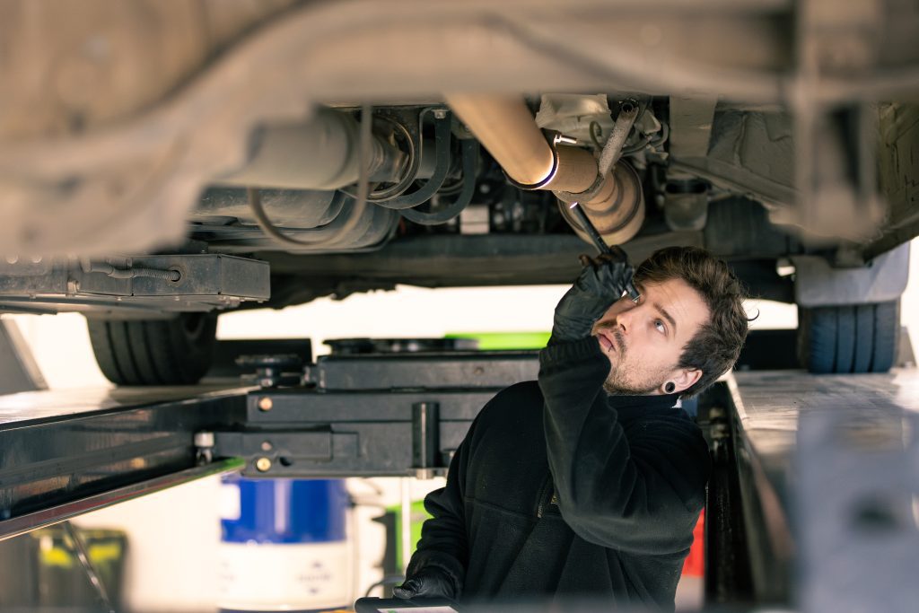 eurostar diesels technician checking under vehicle