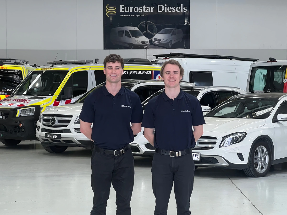 eurostar team in front of mercedes cars